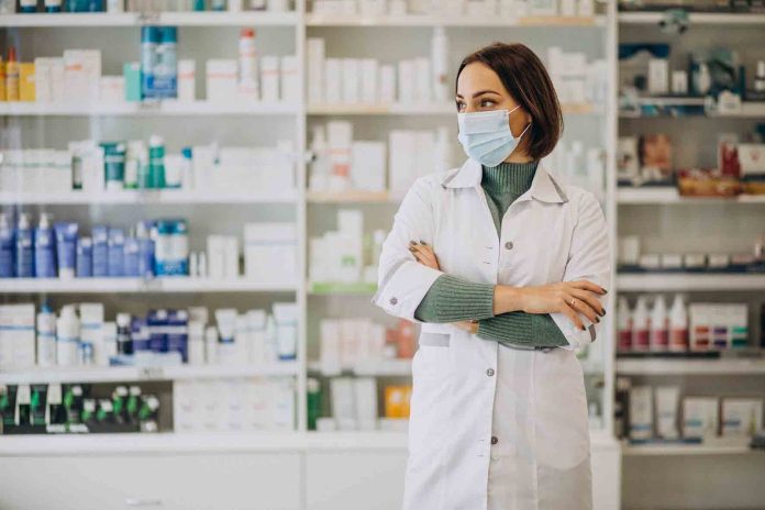 Young woman pharmacist at pharmacy